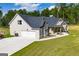 House with large backyard, detached garage, and driveway at 1291 Pleasant Grove Church Rd, Villa Rica, GA 30180
