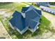 Aerial view showcasing the rear of a house with a large covered patio at 1291 Pleasant Grove Church Rd, Villa Rica, GA 30180