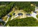 Aerial view of homes nestled in a wooded area with spacious lots at 1291 Pleasant Grove Church Rd, Villa Rica, GA 30180