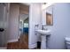 Convenient bathroom with pedestal sink, view to living room at 1291 Pleasant Grove Church Rd, Villa Rica, GA 30180