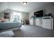 Spacious bedroom with large window and built-in entertainment center at 1291 Pleasant Grove Church Rd, Villa Rica, GA 30180