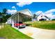 Carport with a red truck parked inside at 1291 Pleasant Grove Church Rd, Villa Rica, GA 30180