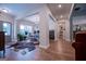 Bright dining room with chandelier and hardwood floors, offering views to the kitchen and backyard at 1291 Pleasant Grove Church Rd, Villa Rica, GA 30180