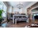 Elegant dining room with chandelier, statement art and open concept to living room at 1291 Pleasant Grove Church Rd, Villa Rica, GA 30180
