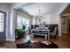 Bright dining room featuring a rustic table, chandelier, and hardwood floors at 1291 Pleasant Grove Church Rd, Villa Rica, GA 30180