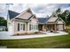 House with a side-entry garage, covered porch, and landscaping at 1291 Pleasant Grove Church Rd, Villa Rica, GA 30180