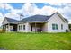 House with covered patio, grilling area, and a spacious yard at 1291 Pleasant Grove Church Rd, Villa Rica, GA 30180