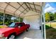 Attached garage with white door and red truck at 1291 Pleasant Grove Church Rd, Villa Rica, GA 30180