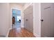 Light hallway with gray doors and wood-look flooring at 1291 Pleasant Grove Church Rd, Villa Rica, GA 30180