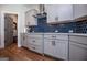 Modern kitchen with gray cabinets, hexagon tile backsplash and stainless steel appliances at 1291 Pleasant Grove Church Rd, Villa Rica, GA 30180