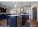 Modern kitchen with large island, stainless steel appliances and blue cabinetry at 1291 Pleasant Grove Church Rd, Villa Rica, GA 30180