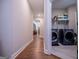 Laundry room with washer, dryer, and storage shelves at 1291 Pleasant Grove Church Rd, Villa Rica, GA 30180