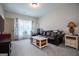 Cozy living room featuring a brown leather couch and coffee table at 1291 Pleasant Grove Church Rd, Villa Rica, GA 30180