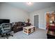Spacious living area with a brown leather couch and coffee table at 1291 Pleasant Grove Church Rd, Villa Rica, GA 30180