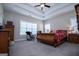 Main bedroom with tray ceiling, hardwood floors and ample natural light at 1291 Pleasant Grove Church Rd, Villa Rica, GA 30180