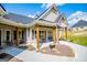 Charming covered porch with seating area and landscaping at 1291 Pleasant Grove Church Rd, Villa Rica, GA 30180