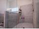 Large walk-in shower with tiled walls and built-in shelves at 1291 Pleasant Grove Church Rd, Villa Rica, GA 30180