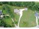 Stunning aerial view of the home with expansive lawn and tree-lined perimeter at 2204 Happy Hollow Se Ct, Conyers, GA 30094