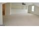 This versatile room offers a comfortable space with its neutral tones, carpet flooring, and natural light at 2204 Happy Hollow Se Ct, Conyers, GA 30094