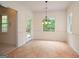 Bright dining area with a door to the deck and tiled flooring at 2204 Happy Hollow Se Ct, Conyers, GA 30094
