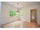 Cozy dining area with tile floors, natural light, and modern light fixture at 2204 Happy Hollow Se Ct, Conyers, GA 30094