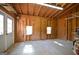 Spacious garage interior with shelving, peg board walls and ample lighting at 2204 Happy Hollow Se Ct, Conyers, GA 30094