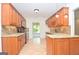 Well-lit kitchen featuring custom cabinets, granite countertops, and stainless steel appliances at 2204 Happy Hollow Se Ct, Conyers, GA 30094