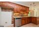 Kitchen featuring custom cabinets, granite countertops, and stainless steel appliances at 2204 Happy Hollow Se Ct, Conyers, GA 30094