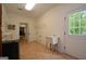 Spacious laundry room with wash sink, cabinet storage, shelving, and access to the outdoors at 2204 Happy Hollow Se Ct, Conyers, GA 30094