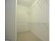 Walk-in closet with carpet flooring and wire shelving at 2204 Happy Hollow Se Ct, Conyers, GA 30094