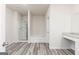 Main bathroom with soaking tub, shower, and granite vanity at 281 Limestone Cir, Conyers, GA 30013