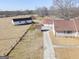 Aerial view of property showing house and outbuildings at 444 Agape Rd, Carrollton, GA 30116