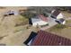 Aerial view of a property with a house, barn, and other outbuildings at 444 Agape Rd, Carrollton, GA 30116