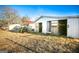 White barn with two stalls and tractor in view at 444 Agape Rd, Carrollton, GA 30116