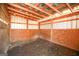 Empty horse stall with dirt floor and wooden walls at 444 Agape Rd, Carrollton, GA 30116