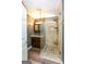 Modern bathroom with large glass shower and dark wood vanity at 444 Agape Rd, Carrollton, GA 30116