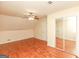 Spacious bedroom with wood floors, closet, and ceiling fan at 444 Agape Rd, Carrollton, GA 30116