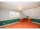 Bedroom with wood floors, ceiling fan, and built-in desk at 444 Agape Rd, Carrollton, GA 30116