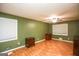 Spacious bedroom with wood flooring and ceiling fan at 444 Agape Rd, Carrollton, GA 30116