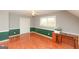 Spacious bedroom with wood floors, a ceiling fan, and ample closet space at 444 Agape Rd, Carrollton, GA 30116