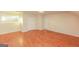 Simple bedroom with wood floors, closet, and window at 444 Agape Rd, Carrollton, GA 30116