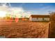 White barn on a large lot with open field at 444 Agape Rd, Carrollton, GA 30116
