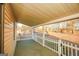 Covered front porch with white picket fence and view of trees at 444 Agape Rd, Carrollton, GA 30116