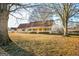 Ranch-style house with a front porch and large yard at 444 Agape Rd, Carrollton, GA 30116