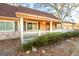 Beige house with green shutters, a white picket fence, and landscaping at 444 Agape Rd, Carrollton, GA 30116