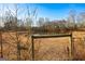 Serene pond nestled within a tree-lined landscape at 444 Agape Rd, Carrollton, GA 30116