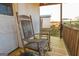 Relaxing porch with two wooden rocking chairs at 444 Agape Rd, Carrollton, GA 30116
