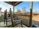 Wooden rocking chairs on porch overlooking yard at 444 Agape Rd, Carrollton, GA 30116