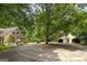 Property view showing home, detached garage, and circular driveway at 731 Airline Rd, Mcdonough, GA 30252