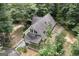 A-frame house nestled in a lush, wooded setting at 731 Airline Rd, Mcdonough, GA 30252